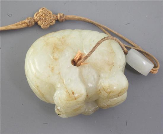 A Chinese pale celadon and russet jade figure of an elephant, 18th century, length 4.6cm